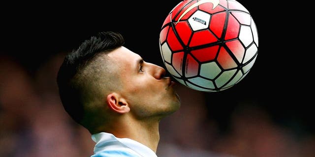 MANCHESTER, ENGLAND - OCTOBER 03: Sergio Aguero of Manchester City kisses the ball to celebrate a goal and his hat-trick during the Barclays Premier League match between Manchester City and Newcastle United at Etihad Stadium on October 3, 2015 in Manchester, United Kingdom. (Photo by Dean Mouhtaropoulos/Getty Images)