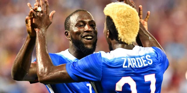 Jozy Altidore (L) of the US celebrates with teammate Gyasi Zardes after scoring his second goal against Peru during an international friendly football match at RFK Stadium in Washington, DC, on September 4, 2015. AFP PHOTO/NICHOLAS KAMM (Photo credit should read NICHOLAS KAMM/AFP/Getty Images)