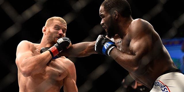 LAS VEGAS, NV - SEPTEMBER 05: (R-L) Corey Anderson punches Jan Blachowicz in their light heavyweight bout during the UFC 191 event inside MGM Grand Garden Arena on September 5, 2015 in Las Vegas, Nevada. (Photo by Jeff Bottari/Zuffa LLC/Zuffa LLC via Getty Images)