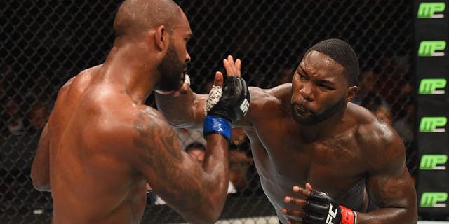 LAS VEGAS, NV - SEPTEMBER 05: (R-L) Anthony Johnson punches Jimi Manuwa in their light heavyweight bout during the UFC 191 event inside MGM Grand Garden Arena on September 5, 2015 in Las Vegas, Nevada. (Photo by Josh Hedges/Zuffa LLC/Zuffa LLC via Getty Images)