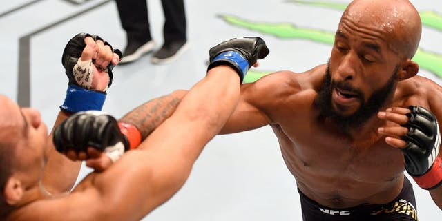LAS VEGAS, NV - SEPTEMBER 05: (R-L) Demetrious Johnson punches John Dodson in their flyweight championship bout during the UFC 191 event inside MGM Grand Garden Arena on September 5, 2015 in Las Vegas, Nevada. (Photo by Josh Hedges/Zuffa LLC/Zuffa LLC via Getty Images)