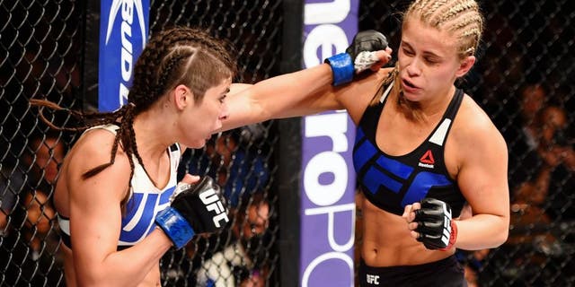 LAS VEGAS, NV - SEPTEMBER 05: (L-R) Alex Chambers punches Paige VanZant in their women's strawweight bout during the UFC 191 event inside MGM Grand Garden Arena on September 5, 2015 in Las Vegas, Nevada. (Photo by Josh Hedges/Zuffa LLC/Zuffa LLC via Getty Images)