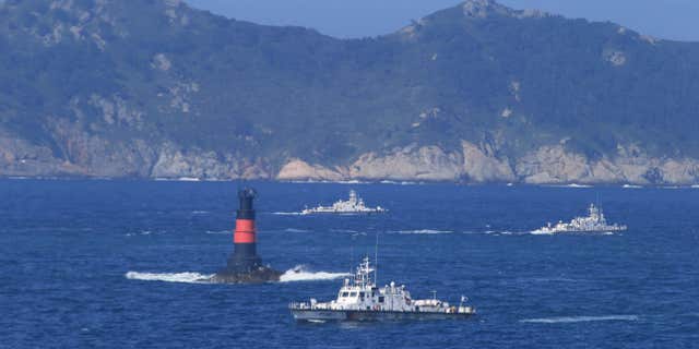 Sept. 6, 2015: South Korean Coast Guard ships sail to search for missing passengers who were on a capsized fishing boat in the water off north of the resort island of Jeju, South Korea.