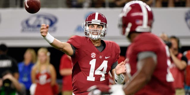 Sep 5, 2015; Arlington, TX, USA; Alabama Crimson Tide quarterback Jake Coker (14) passes against the Wisconsin Badgers during the second quarter at AT&T Stadium. Mandatory Credit: Richard Mackson-USA TODAY Sports