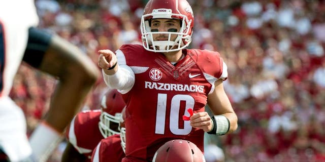 Sep 5, 2015; Fayetteville, AR, USA; Arkansas Razorbacks quarterback Brandon Allen (10) points to UTEP Miners defensive back Michael Lewis (39) during the second half at Donald W. Reynolds Razorback Stadium. The Razorbacks defeat the Miners 48-13. Mandatory Credit: Jerome Miron-USA TODAY Sports