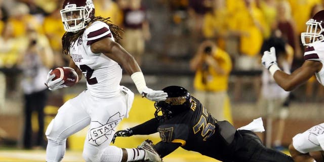 Sep 5, 2015; Hattiesburg, MS, USA; Mississippi State Bulldogs running back Ashton Shumpert (32) runs away from Southern Miss Golden Eagles linebacker Sherrod Ruff (37) in the first quarter of their game at M.M. Roberts Stadium. Mandatory Credit: Chuck Cook-USA TODAY Sports