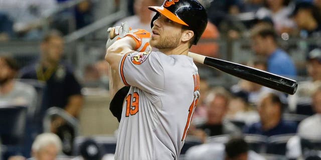 Baltimore Orioles' Chris Davis hits a home run during the ninth inning of a baseball game against the New York Yankees on Tuesday, Sept. 8, 2015, in New York. The Orioles won 2-1. (AP Photo/Frank Franklin II)