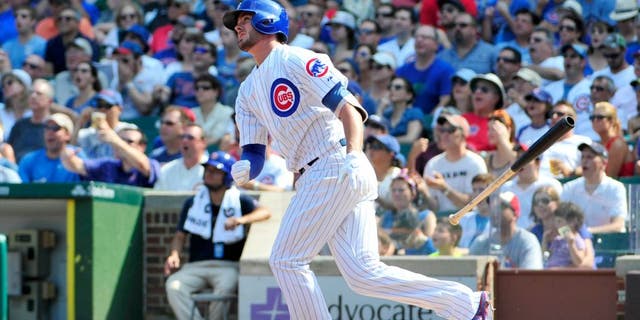 CHICAGO, IL - SEPTEMBER 06: Kris Bryant #17 of the Chicago Cubs hits a home run against the Arizona Diamondbacks during the fifth inning on September 6, 2015 at Wrigley Field in Chicago, Illinois. (Photo by David Banks/Getty Images)
