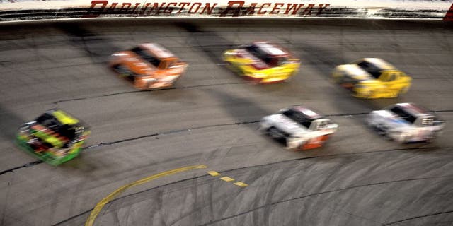 DARLINGTON, SC - SEPTEMBER 06: Kyle Larson, driver of the #42 Mello Yello Chevrolet, leads a pack of cars during the NASCAR Sprint Cup Series Bojangles' Southern 500 at Darlington Raceway on September 6, 2015 in Darlington, South Carolina. (Photo by Jonathan Moore/Getty Images)