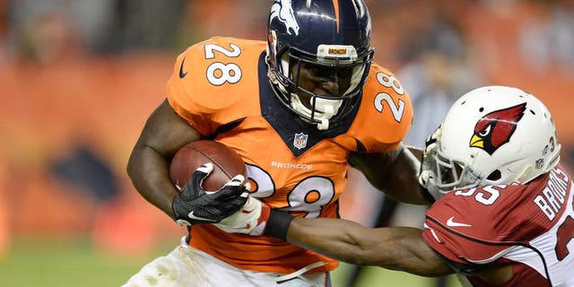 Sep 3, 2015; Denver, CO, USA; Denver Broncos running back Montee Ball (28) is tackled by Arizona Cardinals defensive back Cariel Brooks (35) in the third quarter of a preseason game at Sports Authority Field at Mile High. The Cardinals defeated the Broncos 22-20. Mandatory Credit: Ron Chenoy-USA TODAY Sports