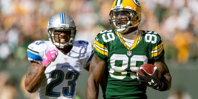 GREEN BAY, WI - OCTOBER 6: James Jones #89 of the Green Bay Packers runs during a 83 yard touchdown catch against the Chris Houston #23 of the Detroit Lions at Lambeau Field on October 6, 2013 in Green Bay, Wisconsin. The Packers defeated the Lions 22-9. (Photo Tom Lynn /Getty Images)