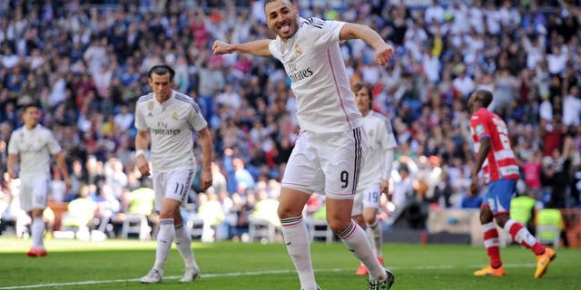 MADRID, SPAIN - APRIL 05: Karim Benzema of Real Madrid CF celebrates after scoring his team's 7th goal during the La Liga match between Real Madrid CF and Granada CF at Estadio Santiago Bernabeu on April 5, 2015 in Madrid, Spain. (Photo by Denis Doyle/Getty Images)
