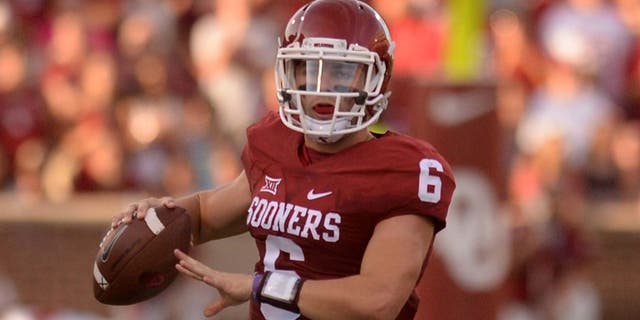 Sep 5, 2015; Norman, OK, USA; Oklahoma Sooners quarterback Baker Mayfield (6) runs with the ball while being pursued by Oklahoma Sooners linebacker Tay Evans (9) during the first quarter at Gaylord Family - Oklahoma Memorial Stadium. Mandatory Credit: Mark D. Smith-USA TODAY Sports
