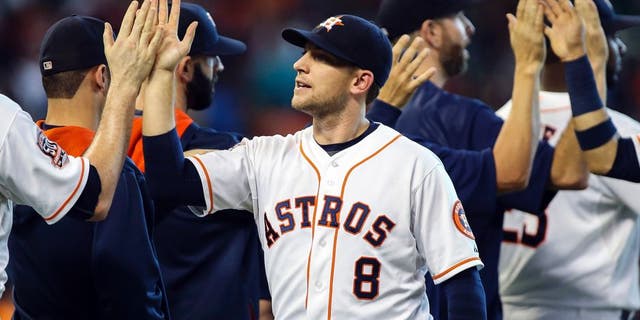 Sep 6, 2015; Houston, TX, USA; Houston Astros third baseman Jed Lowrie (8) celebrates with teammates after the Astros defeated the Minnesota Twins 8-5 at Minute Maid Park. Mandatory Credit: Troy Taormina-USA TODAY Sports