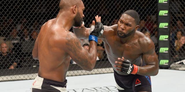 LAS VEGAS, NV - SEPTEMBER 05: (R-L) Anthony Johnson punches Jimi Manuwa in their light heavyweight bout during the UFC 191 event inside MGM Grand Garden Arena on September 5, 2015 in Las Vegas, Nevada. (Photo by Josh Hedges/Zuffa LLC/Zuffa LLC via Getty Images)
