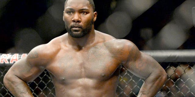 Sep 5, 2015; Las Vegas, NV, USA; Anthony Johnson (red gloves) stands in the ring after defeating Jimi Manuwa (not shown) following their light heavyweight bout at UFC 191 at MGM Grand Garden Arena. Mandatory Credit: Jayne Kamin-Oncea-USA TODAY Sports