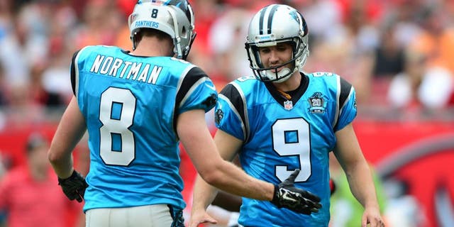 Sep 7, 2014; Tampa, FL, USA; Carolina Panthers punter Brad Nortman (8) congratulates kicker Graham Gano (9) after a field goal during the second quarter against the Tampa Bay Buccaneers at Raymond James Stadium. Mandatory Credit: Andrew Weber-USA TODAY Sports