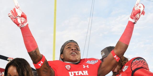 LAS VEGAS, NV - DECEMBER 20: Wide receiver Dominique Hatfield #15 of the Utah Utes celebrates after the team defeated the Colorado State Rams 45-10 in the Royal Purple Las Vegas Bowl at Sam Boyd Stadium on December 20, 2014 in Las Vegas, Nevada. (Photo by Ethan Miller/Getty Images)