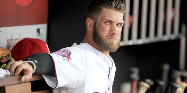 WASHINGTON, DC - AUGUST 30: Bryce Harper #34 of the Washington Nationals watches the game against the Miami Marlins at Nationals Park on August 30, 2015 in Washington, DC. (Photo by G Fiume/Getty Images)