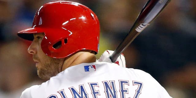 Aug 28, 2015; Arlington, TX, USA; Texas Rangers catcher Chris Gimenez (38) bats in the seventh inning against the Baltimore Orioles at Globe Life Park in Arlington. Texas won 4-1. Mandatory Credit: Tim Heitman-USA TODAY Sports
