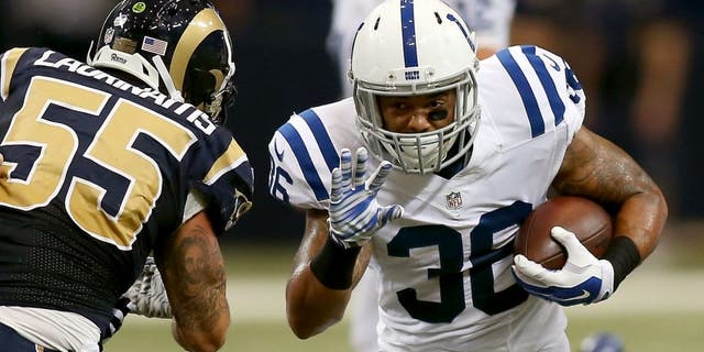 Aug 29, 2015; St. Louis, MO, USA; Indianapolis Colts running back Dan Herron (36) carries the ball past St. Louis Rams middle linebacker James Laurinaitis (55) during the first quarter of a football game at the Edward Jones Dome. Mandatory Credit: Scott Kane-USA TODAY Sports
