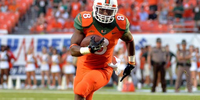 Sep 6, 2014; Miami Gardens, FL, USA; Miami Hurricanes running back Duke Johnson (8) runs against Florida A&M Rattlers defense during the first half at Sun Life Stadium. Mandatory Credit: Steve Mitchell-USA TODAY Sports