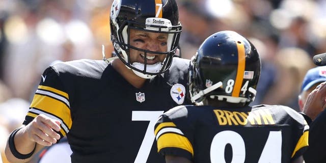 Sep 7, 2014; Pittsburgh, PA, USA; Pittsburgh Steelers quarterback Ben Roethlisberger (7) and wide receiver Antonio Brown (84) celebrate a touchdown against the Cleveland Browns during the second quarter at Heinz Field. Mandatory Credit: Charles LeClaire-USA TODAY Sports
