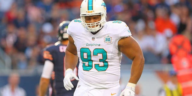 Aug 13, 2015; Chicago, IL, USA; Miami Dolphins defensive tackle Ndamukong Suh (93) reacts to a play during the first quarter of a preseason NFL football game against the Chicago Bears at Soldier Field. Mandatory Credit: Dennis Wierzbicki-USA TODAY Sports