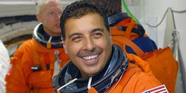 In the White Room on NASA Kennedy Space Center's Launch Pad 39A, STS-128 Mission Specialist Jose Hernandez - a former migrant farmer from Stockton, Calif. - waits his turn to enter space shuttle Discovery during a launch rehearsal for his Aug.