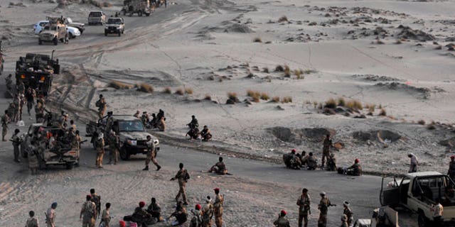 Sept. 10: Yemeni Army forces rest at the southern city of Zinjibar, Yemen, after freeing it from the hands of al-Qaida-linked militants.