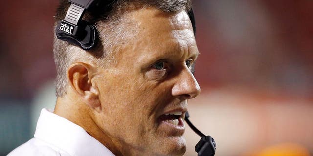 Sep 3, 2015; Salt Lake City, UT, USA; Utah Utes head coach Kyle Whittingham keeps an eye on the field in the final minutes of the game against the Michigan Wolverines at Rice-Eccles Stadium. Mandatory Credit: Jeff Swinger-USA TODAY Sports