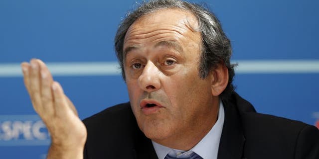 UEFA chief Michel Platini gestures as he speaks during a UEFA press conference after the draw for the UEFA Europa League football group stage 2015/16 on August 28, 2015 in Monaco. AFP PHOTO / VALERY HACHE (Photo credit should read VALERY HACHE/AFP/Getty Images)