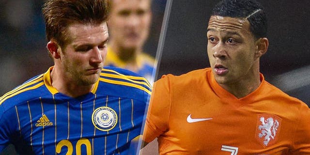 Memphis Depay of Holland during the UEFA Euro 2016 qualifying match between Netherlands and Iceland on September 3, 2015 at the Amsterdam Arena in Amsterdam, The Netherlands.(Photo by VI Images via Getty Images) NUREMBERG, GERMANY - MARCH 26: Mesut Oezil of Germany is challenged by Konstantin Engel of Kazakhstan during the FIFA 2014 World Cup Qualifier match between Germany and Kazakhstan at Grundig-Stadion on March 26, 2013 in Nuremberg, Germany. (Photo by Dennis Grombkowski/Bongarts/Getty Images)