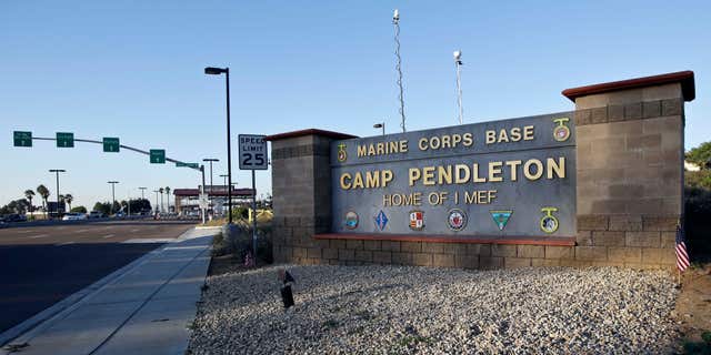 FILE - This Nov. 13, 2013 file photo shows the main gate of Camp Pendleton Marine Base at Camp Pendleton, Calif.