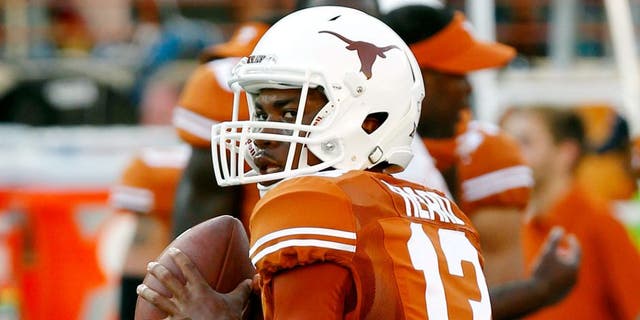 AUSTIN, TX - SEPTEMBER 6: Jerrod Heard #13 of the Texas Longhorns passes during pre game warmups before playing the BYU Cougars on September 6, 2014 at Darrell K Royal-Texas Memorial Stadium in Austin, Texas. (Photo by Chris Covatta/Getty Images)