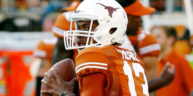 AUSTIN, TX - SEPTEMBER 6: Jerrod Heard #13 of the Texas Longhorns passes during pre game warmups before playing the BYU Cougars on September 6, 2014 at Darrell K Royal-Texas Memorial Stadium in Austin, Texas. (Photo by Chris Covatta/Getty Images)