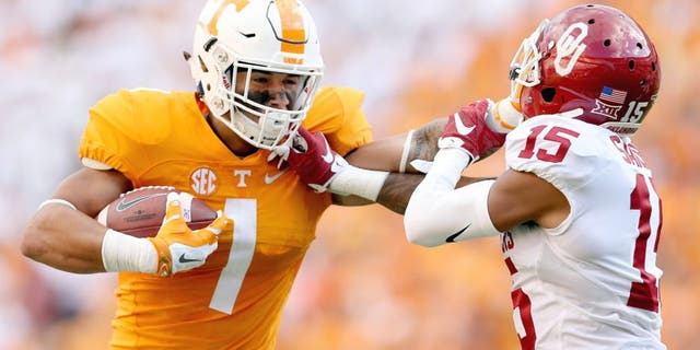 KNOXVILLE, TN - SEPTEMBER 12: Jalen Hurd #1 of the Tennessee Volunteers runs with the ball while defended by Zack Sanchez #25 of the Oklahoma Sooners during the game at Neyland Stadium on September 12, 2015 in Knoxville, Tennessee. (Photo by Andy Lyons/Getty Images)