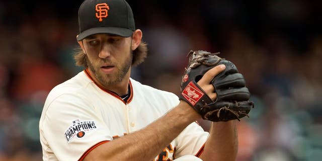 SAN FRANCISCO, CA - SEPTEMBER 12: Starting pitcher Madison Bumgarner #40 of the San Francisco Giants winds up for a pitch against the San Dieigo Padres at AT&T Park in the first inning on September 12, 2015 in San Francisco, California. (Photo by Brian Bahr/Getty Images)