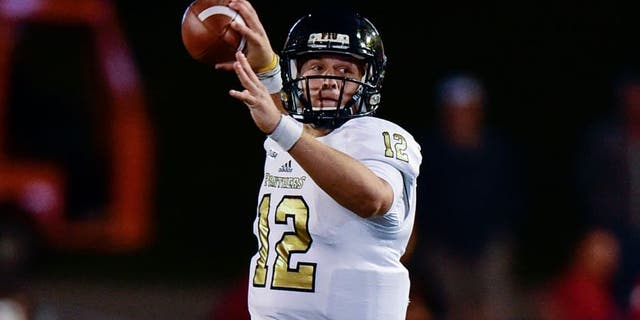 Sep 12, 2015; Bloomington, IN, USA;Florida International University Golden Panthers quarterback Alex McGough (12) throws to a teammate during the first quarter of the game against Indiana Hoosiers at Memorial Stadium. Mandatory Credit: Marc Lebryk-USA TODAY Sports