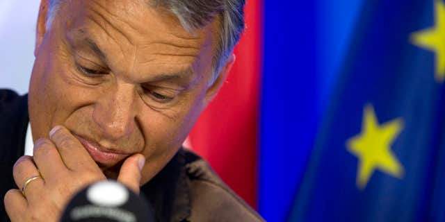 ILE - In this Thursday, Sept. 3, 2015 file photo, Hungarian Prime Minister Viktor Orban pauses before speaking during a media conference at the EU Council building in Brussels.