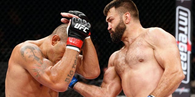 BRASILIA, BRAZIL - SEPTEMBER 13: (R-L) Andrei Arlovski of Belarus lands an uppercut against Antonio "Bigfoot" Silva of Brazil in their heavyweight bout during the UFC Fight Night event inside Nilson Nelson Gymnasium on September 13, 2014 in Brasilia, Brazil. (Photo by Josh Hedges/Zuffa LLC/Zuffa LLC via Getty Images)