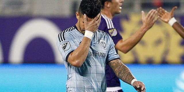 Sep 13, 2015; Orlando, FL, USA; Sporting KC forward Dom Dwyer (14) covers his face after being issued a red card during the second half against the Orlando City FC at Orlando Citrus Bowl Stadium. Mandatory Credit: Reinhold Matay-USA TODAY Sports