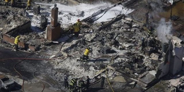 Sept. 10: Firemen work on the remains of a home damaged by a massive fire in a mostly residential neighborhood in San Bruno, Calif. (AP).