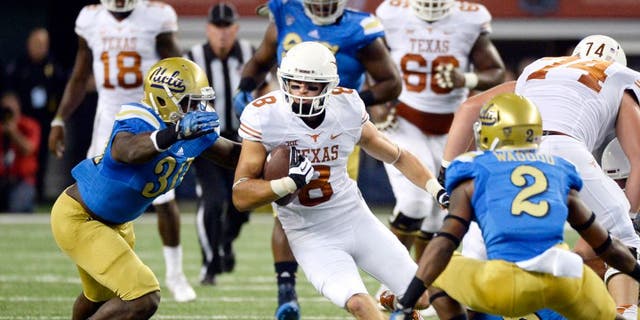 Sep 13, 2014; Arlington, TX, USA; Texas Longhorns wide receiver Jaxon Shipley (8) runs against UCLA Bruins linebacker Myles Jack (30) and defensive back Jaleel Wadood (2)during the first quarter at AT&T Stadium. Mandatory Credit: Richard Mackson-USA TODAY Sports