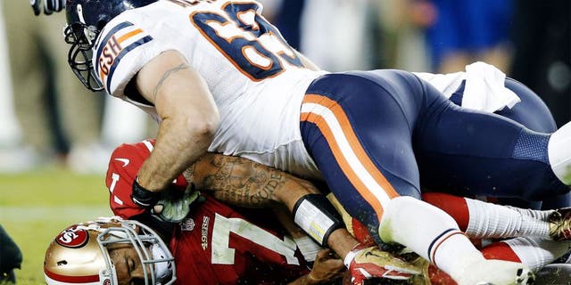 SANTA CLARA, CA - SEPTEMBER 14: Quarterback Colin Kaepernick #7 of the San Francisco 49ers is sacked by defensive end Jared Allen #69 of the Chicago Bears at Levi's Stadium on September 14, 2014 in Santa Clara, California. (Photo by Ezra Shaw/Getty Images)