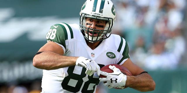 Sep 7, 2014; East Rutherford, NJ, USA; New York Jets tight end Jace Amaro (88) runs with the ball against the Oakland Raiders during a game at MetLife Stadium. The Jets defeated the Raiders 19-14. Mandatory Credit: Brad Penner-USA TODAY Sports