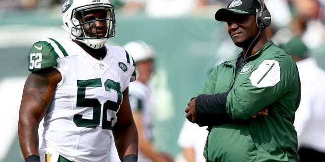 Sep 13, 2015; East Rutherford, NJ, USA; New York Jets head coach Todd Bowles talks to New York Jets linebacker David Harris (52) during the first half at MetLife Stadium. Mandatory Credit: Danny Wild-USA TODAY Sports
