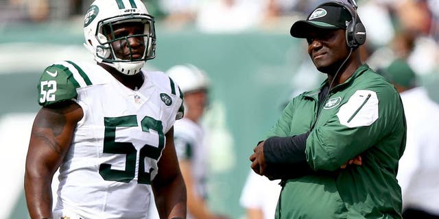 Sep 13, 2015; East Rutherford, NJ, USA; New York Jets head coach Todd Bowles talks to New York Jets linebacker David Harris (52) during the first half at MetLife Stadium. Mandatory Credit: Danny Wild-USA TODAY Sports