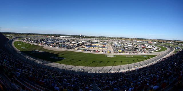 Race fans cheer during the NASCAR Sprint Cup Series myAFibRisk.com 400 at Chicagoland Speedway on September 20, 2015 in Joliet, Illinois.