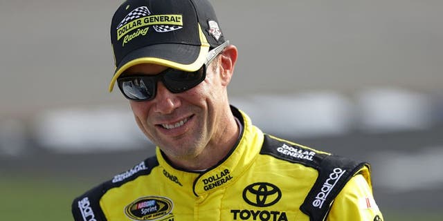 RICHMOND, VA - SEPTEMBER 09: Matt Kenseth, driver of the #20 Dollar General Toyota, stands on the grid during qualifying for the NASCAR Sprint Cup Series Federated Auto Parts 400 at Richmond International Raceway on September 9, 2016 in Richmond, Virginia. (Photo by Chris Graythen/NASCAR via Getty Images)